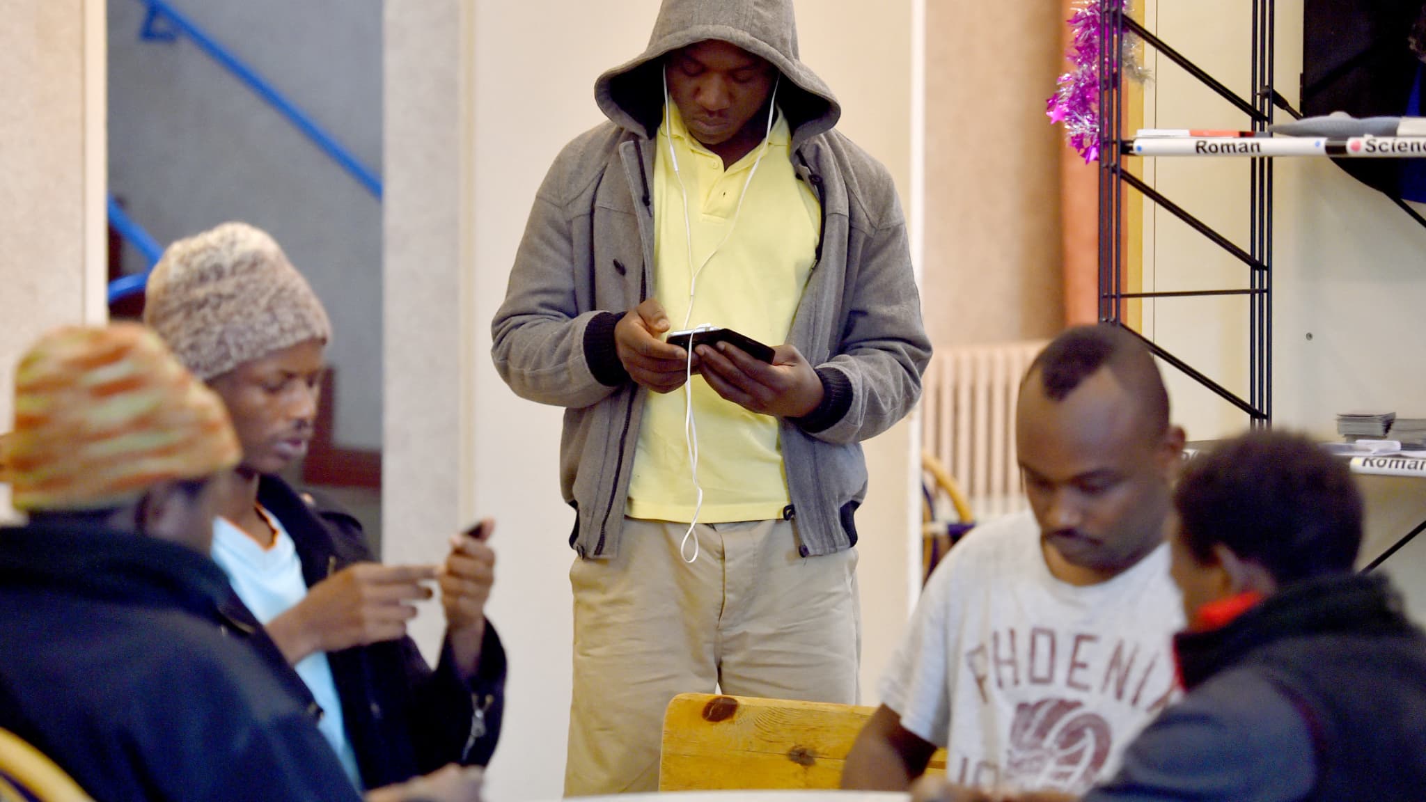 opponents and supporters of a reception center for migrants demonstrate near Saint-Nazaire