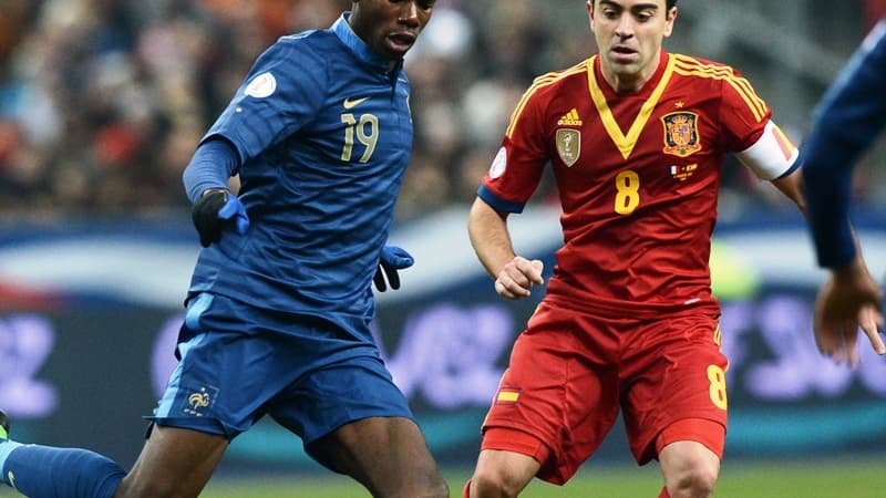 Paul Pogba face à Xavi