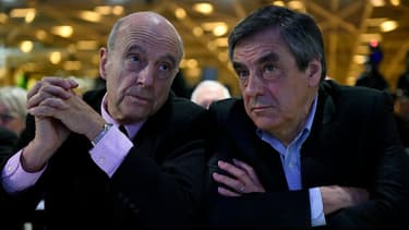Alain Juppé et François Fillon, les deux finalistes de la primaire à droite, le 13 février 2016 à Paris.