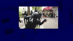 CRS le 1er mai lançant un pavé en direction de manifestant