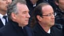 François Bayrou et François Hollande, dans la cour des Invalides pour l'hommage rendu à Raymond Aubrac. Le candidat socialiste a souligné jeudi plusieurs points de convergence avec le centriste François Bayrou, qui a selon lui compris la "fuite en avant"