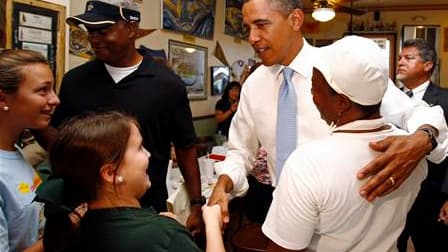 Barack Obama en visite dimanche dans un restaurant de La Nouvelle-Orléans. A l'occasion du cinquième anniversaire des dévastations causées par Katrina, le président américain s'est engagé à achever les travaux de remise en état des zones de la côte du Gol
