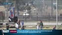 Des manifestants face à un blindé de la police mardi au Venezuela