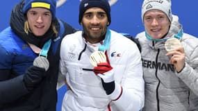 Martin Fourcade aux côtés de Samuelsson et Benedikt Doll 