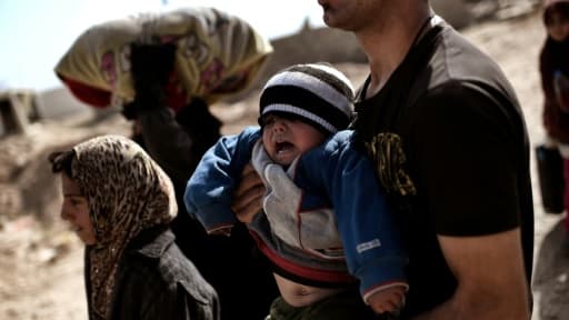 Des familles irakiennes fuient les combats le 28 février 2017 à Mossoul Des familles irakiennes fuient les combats le 28 février 2017 à Mossoul