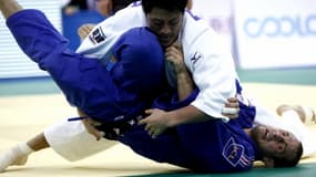 Alain Schmitt (bleu)  lors du dernier tournoi de Chine
