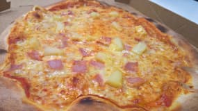 Un pizza à l'ananas. (Photo d'illustration)