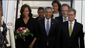 La famille Obama au complet accueillie mardi à Berlin par le ministre allemand des Affaires étrangères Guido Westerwelle.