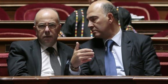 Bernard Cazeneuve et Pierre Moscovici à l'Assemblée.