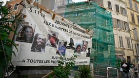 Une affiche montrant les visages des victimes de l'effondrement de la rue d'Aubagne à Marseille
