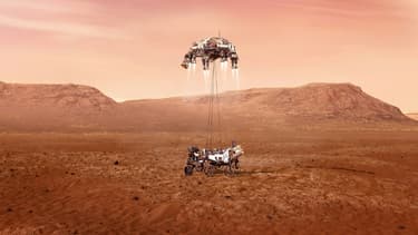 Illustration fournie par la Nasa du rover Perseverance au moment de son atterrissage sur Mars, après avoir descendu les derniers mètres le séparant du sol le long de câbles suspendus depuis l'étage de descente