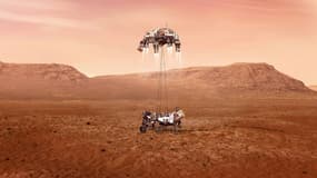Illustration fournie par la Nasa du rover Perseverance au moment de son atterrissage sur Mars, après avoir descendu les derniers mètres le séparant du sol le long de câbles suspendus depuis l'étage de descente 