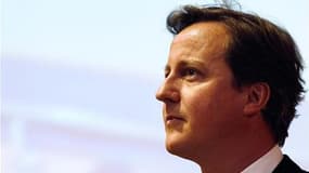 David Cameron mardi à Lagos, au Nigeria, étape de sa tournée en Afrique qu'il a écourtée pour venir affronter, mercredi, les députés britanniques à l'occasion d'un débat extraordinaire à la Chambre des communes sur le scandales des écoutes téléphoniques i