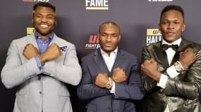 Francis Ngannou, Kamaru Usman et Israel Adesanya (de gauche à droite), les trois champions UFC nés en Afrique
