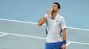 Novak Djokovic célèbre sa victoire face à Taylor Fritz en quarts de finale de l'Open d'Australie (7-6, 4-6, 6-2, 6-3), le 23 janvier 2024