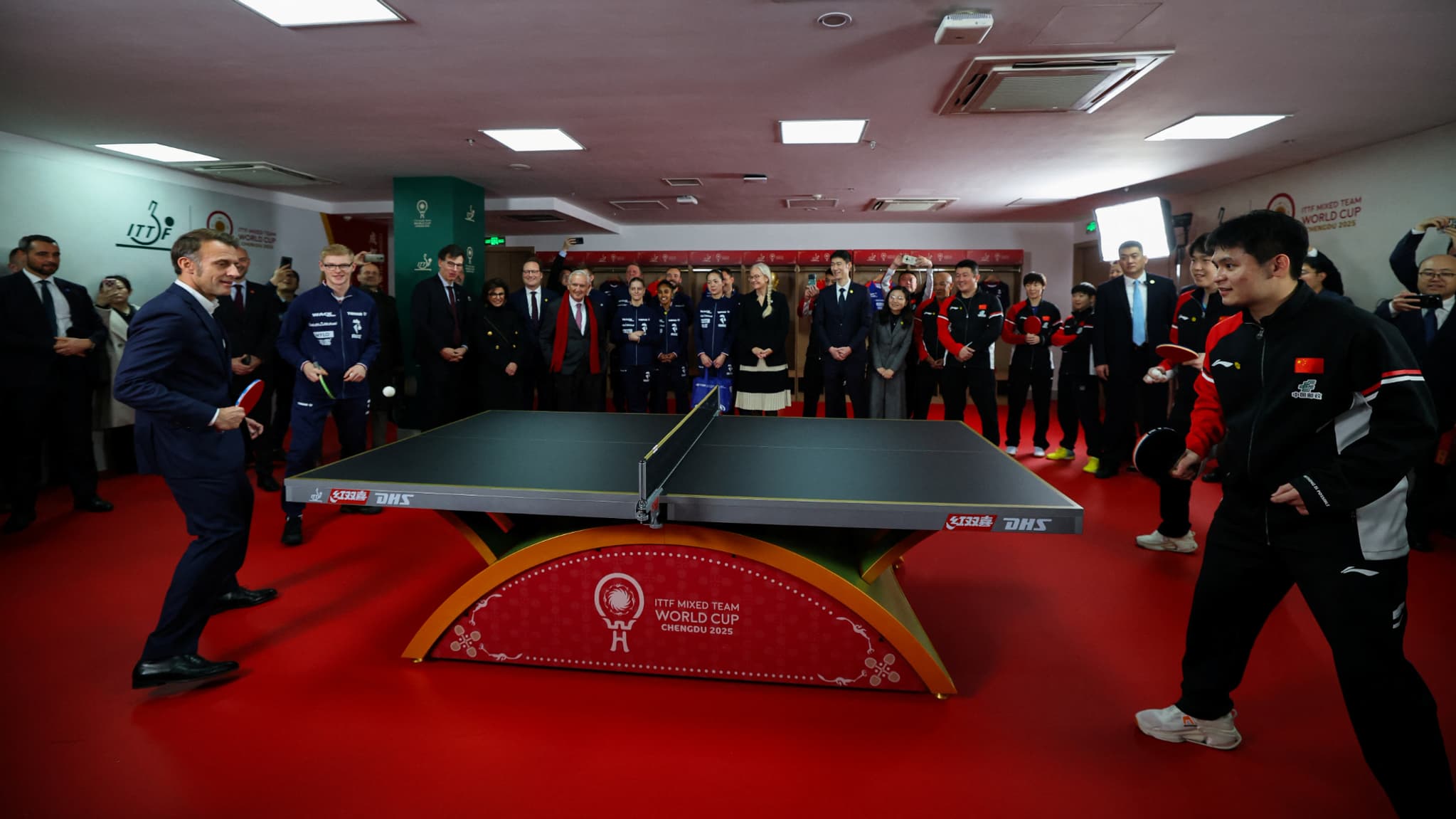 An exchange between the Macron/Lebrun pair and Chinese players in Chengdu, December 5, 2025