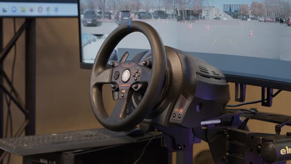 The steering wheel that allows the operator to remotely drive Elmo's car.