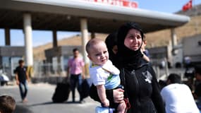 Des réfugiés syriens arrivant en Turquie, le 31 août 2013