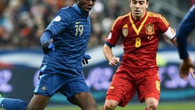 Paul Pogba face à Xavi