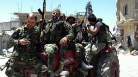 Soldats syriens dans la ville de Qousseir qu'ils viennent de reprendre aux rebelles, le 5 juin dernier.