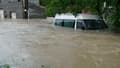 Un véhicule immergé dans des inondations à Bouzonville, en Moselle, le 17 mai 2024
