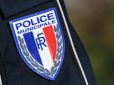Un badge de la police municipale.