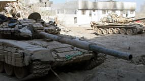 Des chars de l'armée syrienne dans la banlieue de Damas, le 24 août.