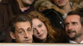 L'ancien président Nicolas Sarkozy à côté de la candidate UMP à la mairie de Paris Nathalie Kosciusko-Morizet au Parc des Princes le 22 décembre 2013.