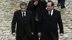 Les ex-présidents français Nicolas Sarkozy et François Hollande le 28 mars 2018 à l'Hôtel des Invalides à Paris.