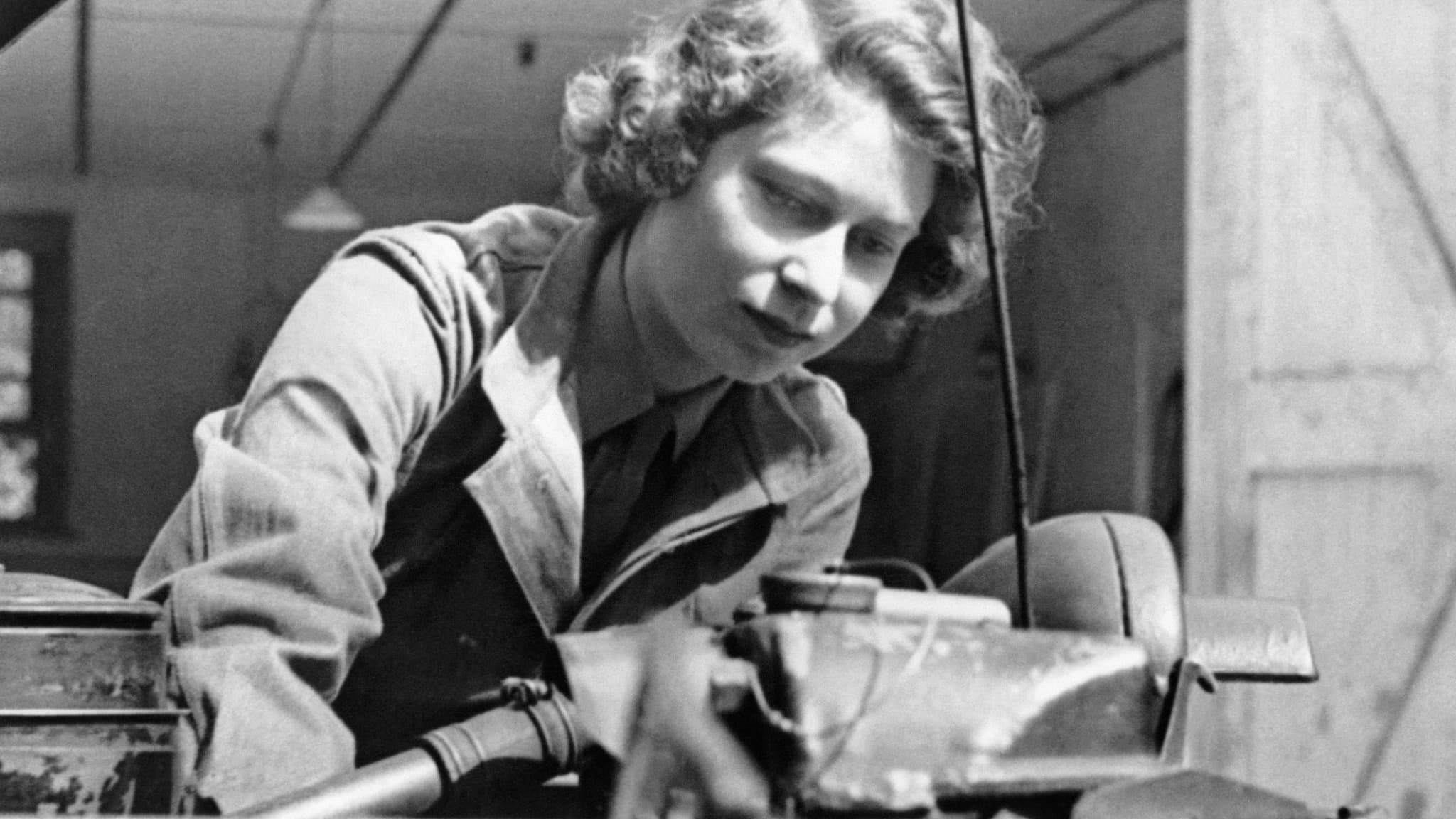 Princess Elizabeth taking out the plugs of a car during training at an A.T.S training centre, in Southern England, in 1945.