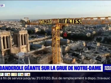 "Climat, aux actes!": Greenpeace déploie une banderole en haut de la grue de Notre-Dame