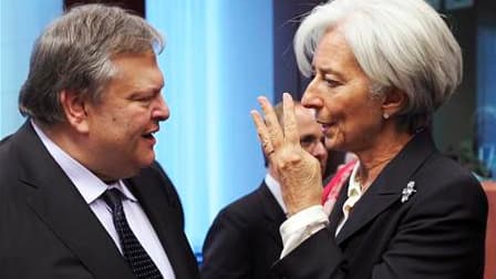Le ministre grec des Finances, Evangelos Venizelos, s'entretient avec la directrice générale du FMI, Christine Lagarde, en ouverture de la réunion des ministres des Finances, vendredi à Bruxelles. Les ministres entament six jours de négociations en espéra
