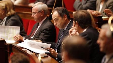 Quatre candidats prétendent à prendre la présidence du groupe UMP de l'Assemblée nationale pour succéder à Jean-François Copé (au centre) élu mercredi au poste de secrétaire général de l'UMP, qui désire se consacrer entièrement à sa nouvelle fonction et r