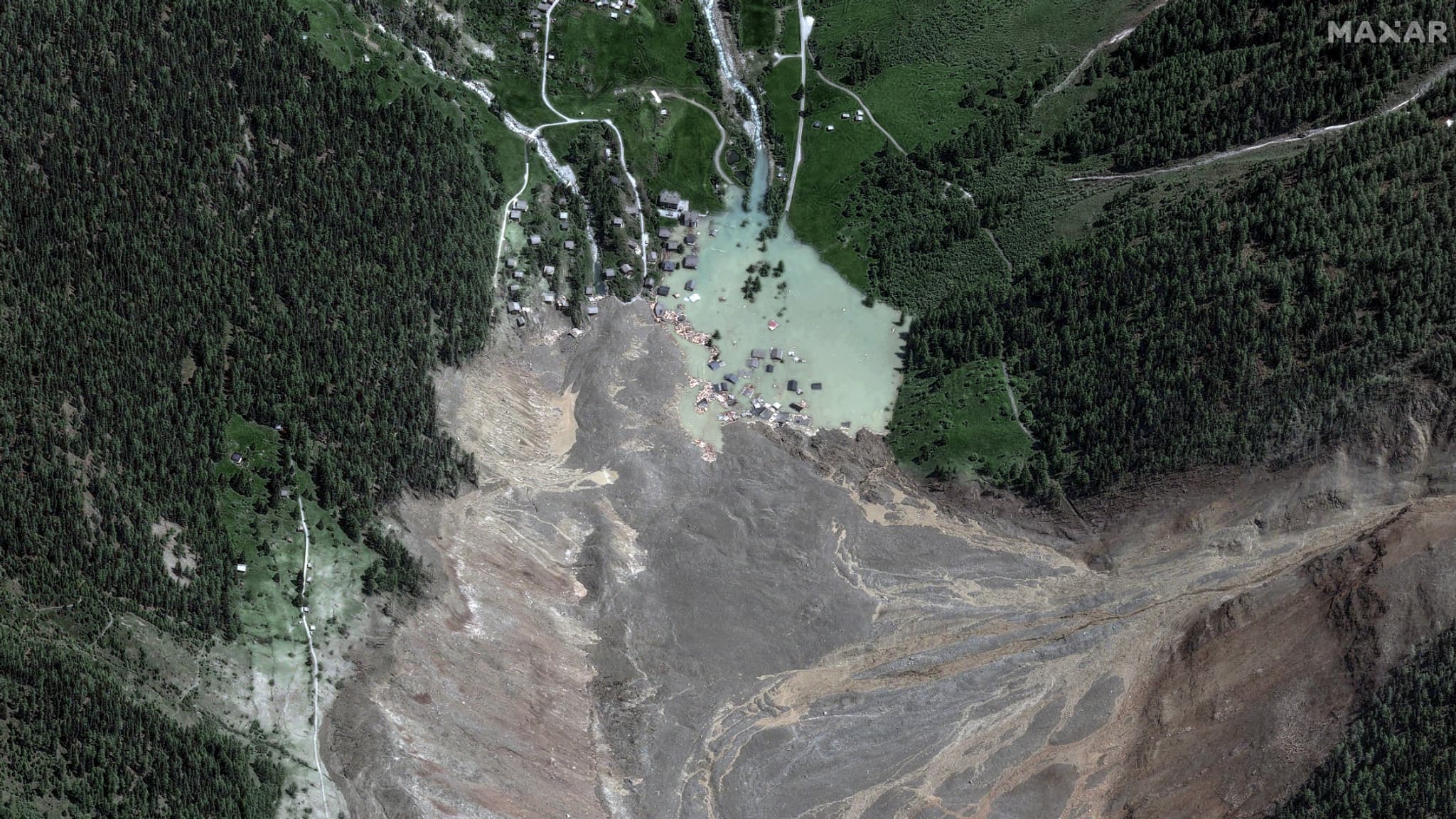 This satellite image shows the small town of Blatten and its surroundings on the Bartschhorn mountain in the Swiss Alps, Switzerland, on May 29, 2025, after it was destroyed the day before by a landslide. This satellite image shows the small town of Blatten and its surroundings on the Bartschhorn mountain in the Swiss Alps, Switzerland, on May 29, 2025, after it was destroyed the day before by a landslide.