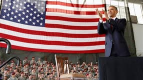Barack Obama a salué mercredi le retour de soldats américains d'Irak, marquant symboliquement la fin de neuf années d'un conflit qui a infligé un tort durable à l'image des Etats-Unis dans le monde et mis leur armée à rude épreuve. /Photo prise le 14 déce