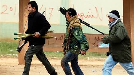 Insurgés libyens à Benghazi. Bravant la résolution du Conseil de sécurité de l'Onu et les préparatifs intensifs d'une intervention militaire internationale, les forces de Mouammar Kadhafi sont entrées samedi dans la ville, soumise selon les rebelles à d'i