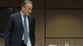 Le PDG d'EDF, Henri Proglio, arrive pour son audition devant une commission d'enquête parlementaire sur les prix de l'électricité, à Paris le 22 octobre 2014