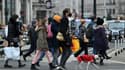 Des piétons masqués dans une rue de Londres, le 23 décembre 2021