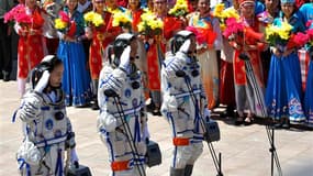 Les taïkonautes chinois (de gauche à droite) Wang Yaping, Nie Haisheng et Zhang Xiaoguang. La Chine, qui ambitionne de devenir une puissance spatiale de premier ordre, a lancé mardi un nouveau vol habité en direction de son module orbital expérimental Tia