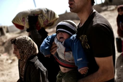 Des familles irakiennes fuient les combats le 28 février 2017 à Mossoul Des familles irakiennes fuient les combats le 28 février 2017 à Mossoul