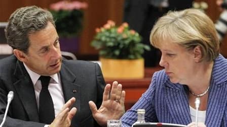 Dans une déclaration commune Nicolas Sarkozy et Angela Merkel (ici lors d'un sommet européen à Bruxelles en juin dernier) pressent l'Italie et l'Espagne d'appliquer rapidement et complètement les mesures de redressement des finances publiques décidées, af