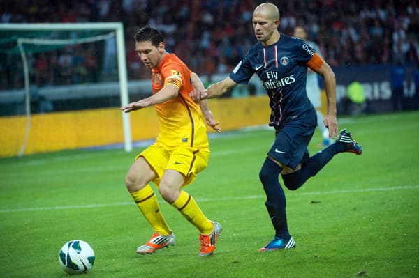 Lionel Messi et Christophe Jallet en 2012 lors d'un amical PSG-Barcelone.