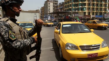 Un soldat à l'entrée de Bagdad, jeudi.