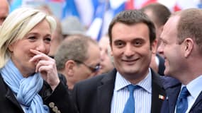 Marine Le Pen, Florian Philippot, et Steeve Briois, le 1er mai 2013, à Paris.