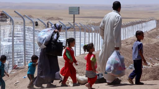 Une famille d'Irakiens dans un camp de réfugiés à 40 kilomètres d'Arbil, le 27 juillet.