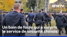 Emmanuel Macron court pour contourner le service de sécurité chinois et prend un bain de foule