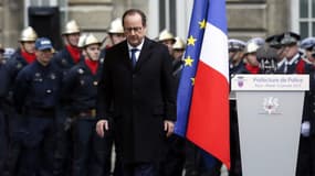 François Hollande, lors de la cérémonie d'hommage aux trois policiers tués dans les attentats, le 13 janvier, à la préfecture de police de Paris.