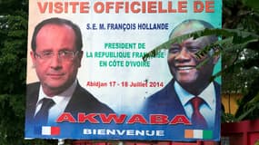 Affiche présentant la visite de François Hollande en Côte d'Ivoire, ici à la droite d' Alassane Ouattara, le président du pays.