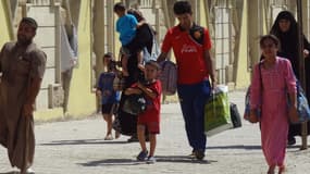 Souvent sans eau, ni nourriture, des milliers de chrétiens d'Irak sont contraints à fuir l'avancée de l'Etat islamique. Ici, des exilés arrivent à la ville de Kirkuk le 7 août 2014.