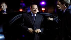Silvio Berlusconi, le président du Conseil italien à son arrivée à Meise, près de Bruxelles, pour le sommet européen. L'Italie et l'Espagne étaient samedi sous une intense pression de leurs pairs de la zone euro pour rassurer sur leur détermination à main